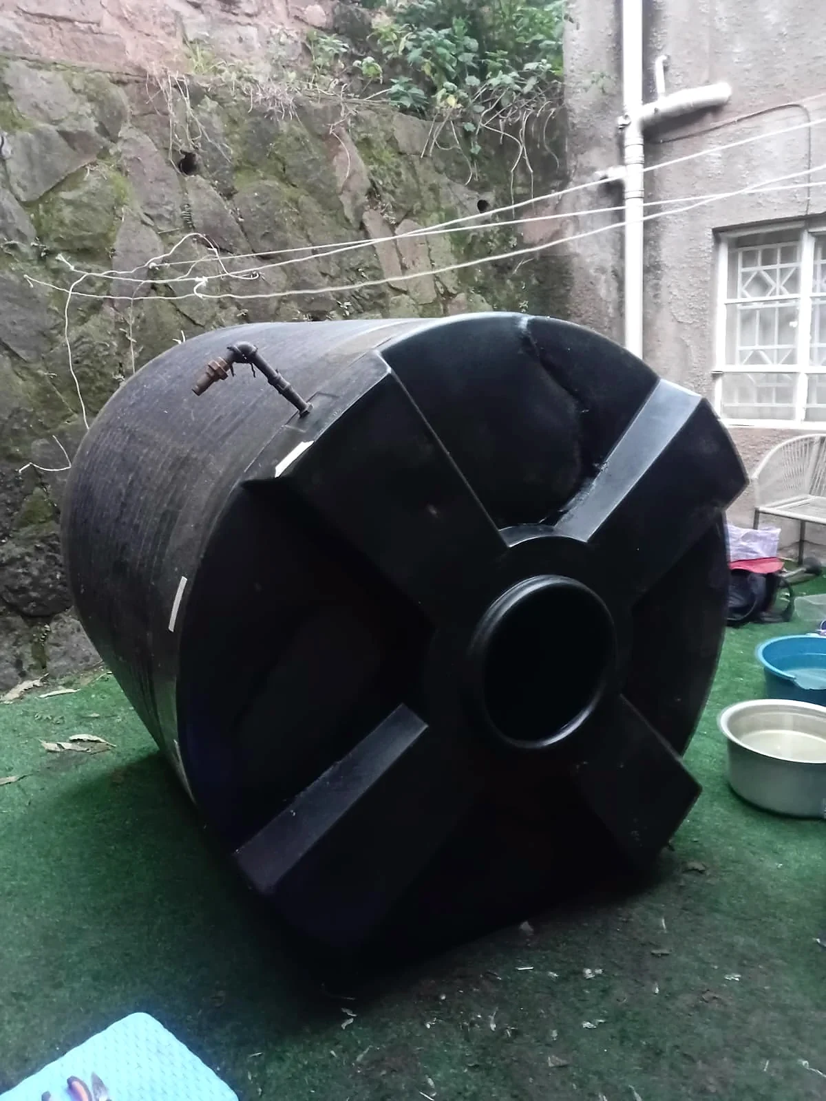 A split black tank welded and restored â after repair